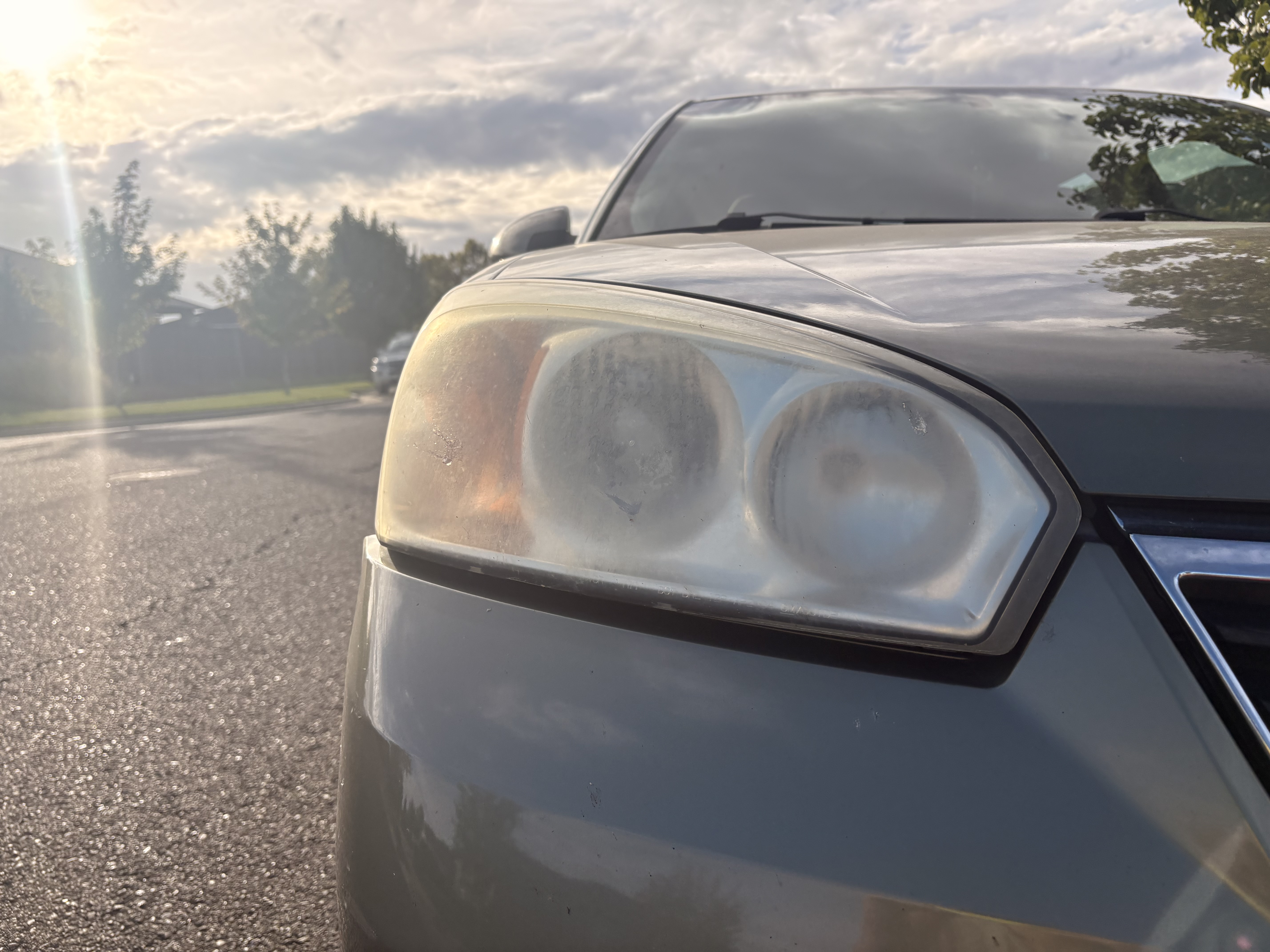 Chevy Malibu headlight before restoration, cloudy and yellowed