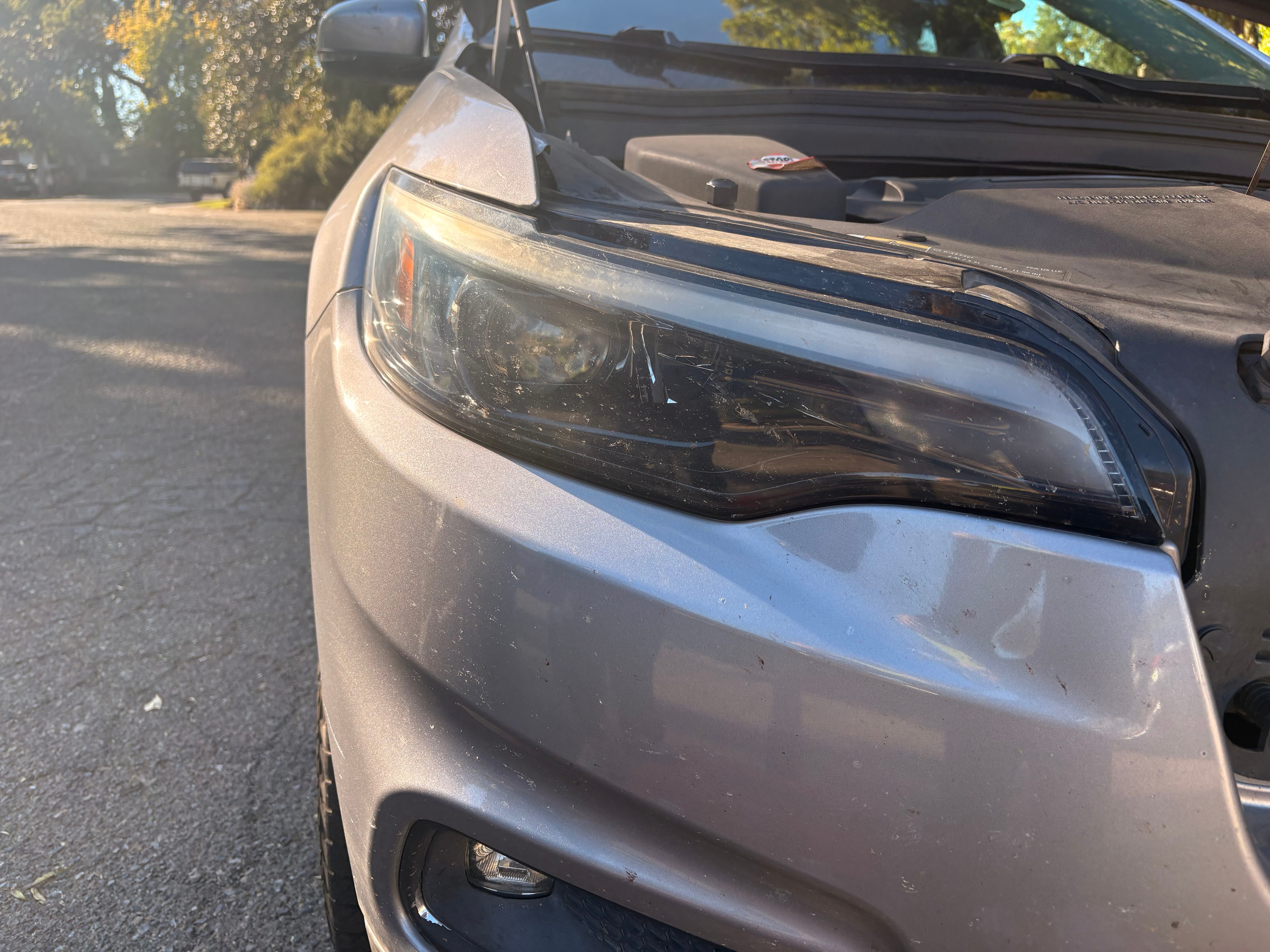 Subaru headlight before restoration, cloudy and yellowed