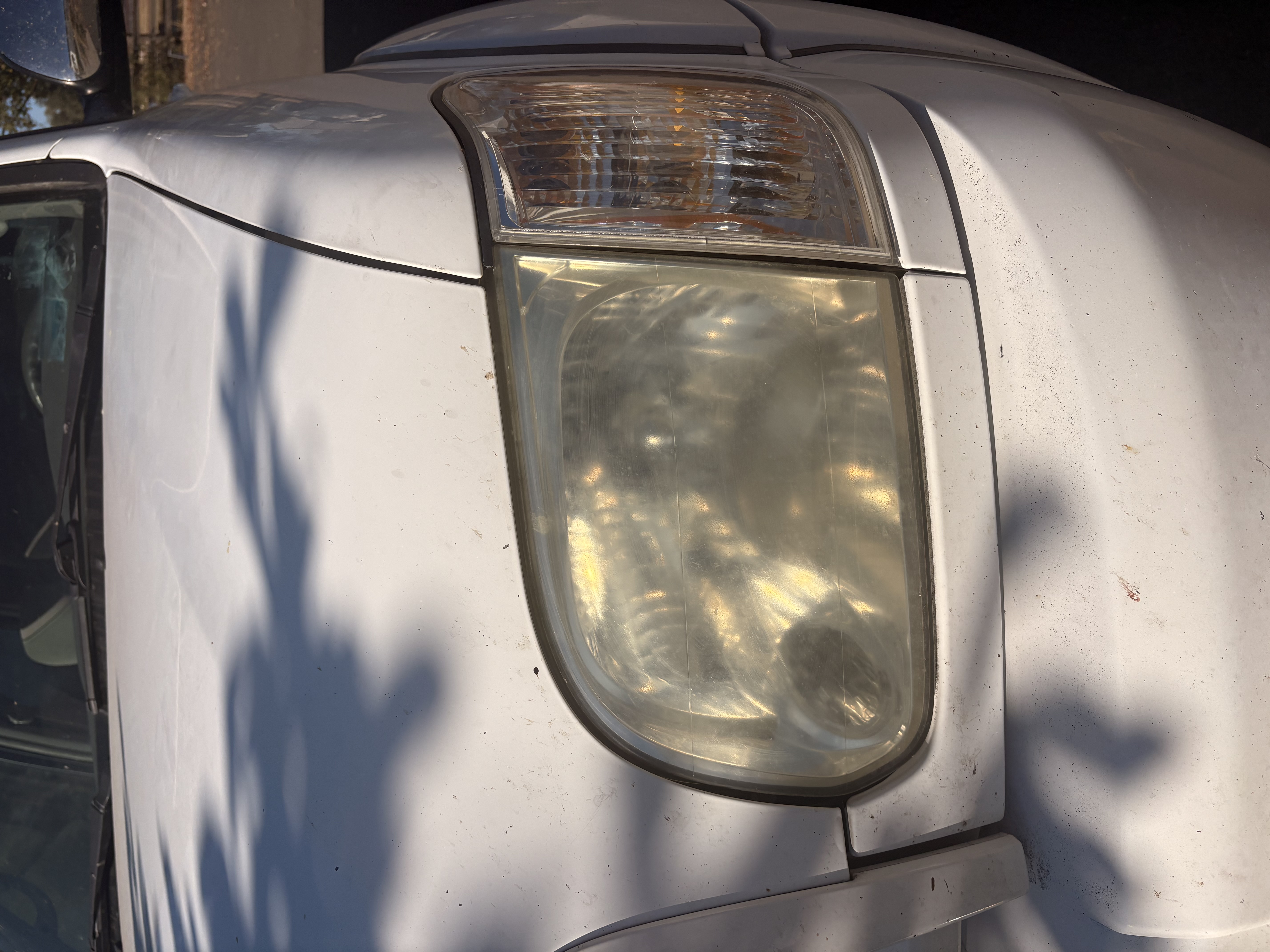 Toyota Tundra headlight before restoration, cloudy and yellowed
